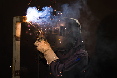 Man working on metal in workshop