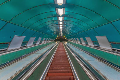 Low angle view of illuminated subway station