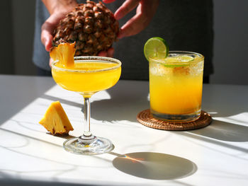 Close-up of pineapple cocktail glass on table