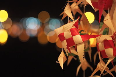 Close-up of christmas lights at night