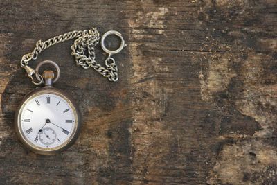 Directly above shot of pocket watch on table