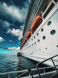 Ship sailing on sea against sky