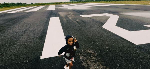 High angle view of man standing on road