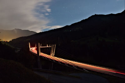 Scenic view of illuminated mountains at night