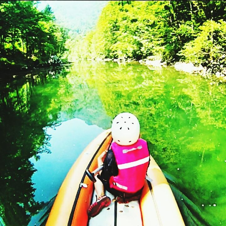 transportation, mode of transport, water, tree, nautical vessel, boat, travel, green color, mountain, nature, part of, vehicle interior, beauty in nature, cropped, journey, day, one person, scenics, tranquility, lake