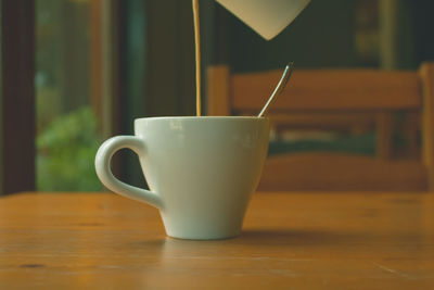 Close-up of coffee cup on table