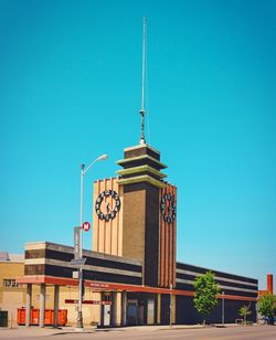 Low angle view of building against clear blue sky