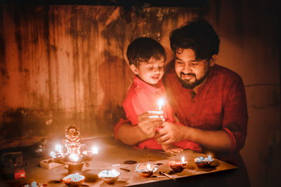 Boy playing with christmas decoration