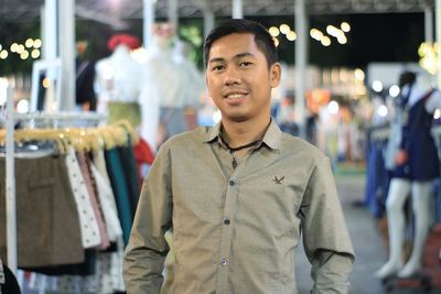 Portrait of young man standing outdoors