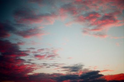 Low angle view of cloudy sky at sunset