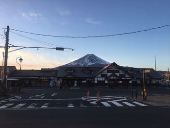 Road in city against clear sky