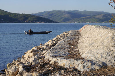 Scenic view of sea against mountains