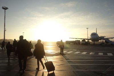 Silhouette of people at sunset