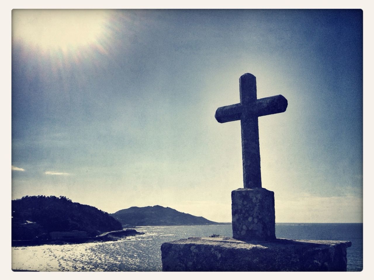 human representation, statue, cross, sculpture, religion, spirituality, art, art and craft, sky, creativity, silhouette, place of worship, outdoors, monument, tranquility, no people