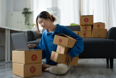 Side view of businessman with toy blocks in office