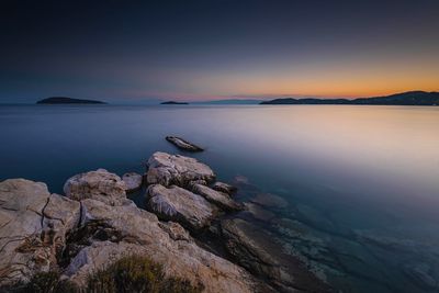 Scenic view of sea against sky at sunset