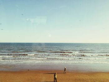 Scenic view of beach against clear sky