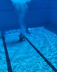 Man swimming in pool