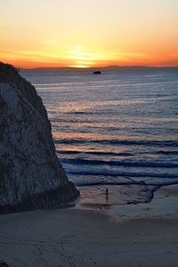 Scenic view of sea at sunset