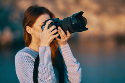 Midsection of woman photographing