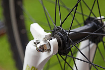 Detail of the front wheel on a bike, here you see spokes and bolt clearly