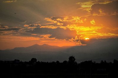 Scenic view of landscape against sky during sunset