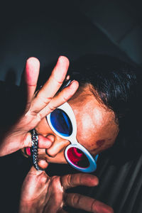 Close-up of man holding hands