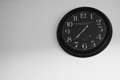 Close-up of clock on white background