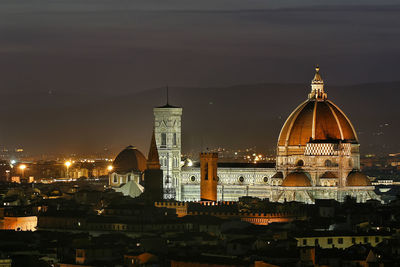 Illuminated buildings in city at night