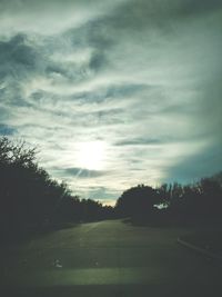 Scenic view of landscape against cloudy sky