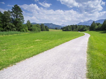 Bavarian foothills of the alps with a gravel path.
