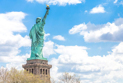 Low angle view of statue against sky