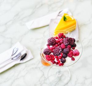 High angle view of fruits in plate on table