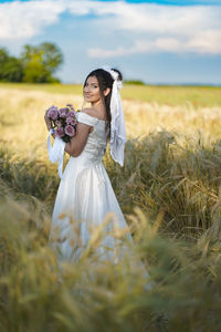 Young woman holding bouquet