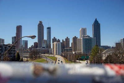 Buildings in atlanta against blue sky