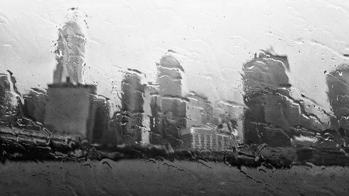 Close-up of wet glass window in rainy season