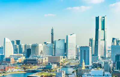 Aerial view of cityscape against sky