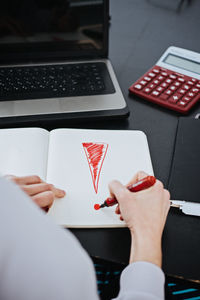 Accounting challenges. accountant, auditor draws an exclamation mark in notepad.