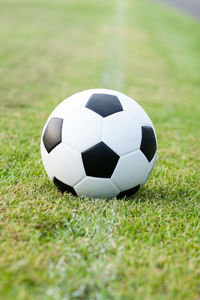 Close-up of soccer ball on grass