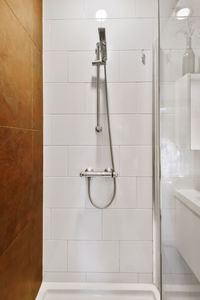 Low angle view of shower head in bathroom