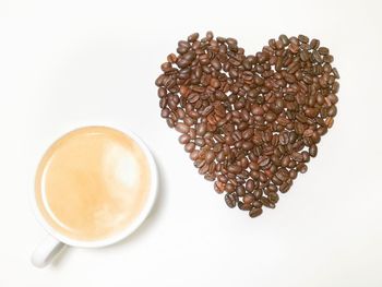 Close-up of coffee cup over white background