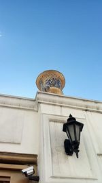 Low angle view of building against blue sky