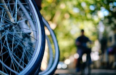 Cropped image of bicycle parked on footpath