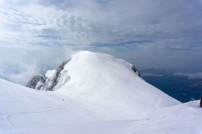 Snow covered mountain against sky