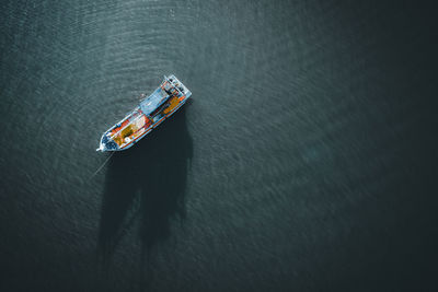 High angle view of ship sailing in sea