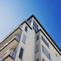 Low angle view of building against blue sky