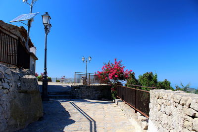 Street light against blue sky