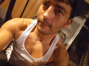 Portrait of young man sitting at home