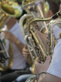 Close-up of people playing trumpet