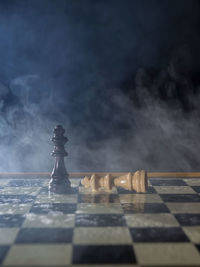 Close-up of chess pieces on table